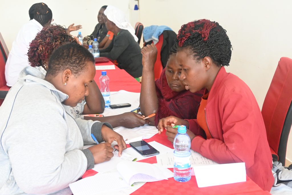 Participants engaged in group discussion during the Leadership and governance training in Tharaka Nith